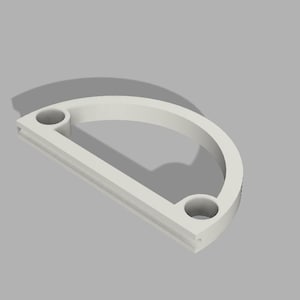 May include: White plastic half-circle frame with two holes. The frame is designed to hold a round object, such as a clock face.