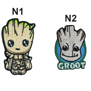 May include: Two embroidered patches featuring a tree-like character. The left patch, labelled N1, shows a full-body figure with light brown and green details. The right patch, labelled N2, shows a head-only figure on a blue circle with the text GROOT.