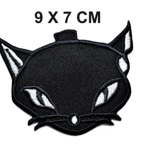 Svart kattansiktslapp, broderad strykapplikation