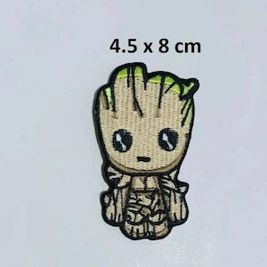 May include: An embroidered iron-on patch featuring a cartoon character of Groot from the Guardians of the Galaxy movie franchise. The patch is 4.5 x 8 cm and features Groot with a green leafy head and brown body.