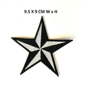 May include: Black and white star-shaped patch with a nautical design. The patch is 9.5 cm wide and 9 cm tall.