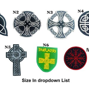 May include: A selection of seven embroidered patches showcasing Celtic and Norse designs. The patches feature a triquetra, Celtic crosses, and a shield with the word "Ireland". The patches are in various shapes and colours, with black, white, green, and red accents.
