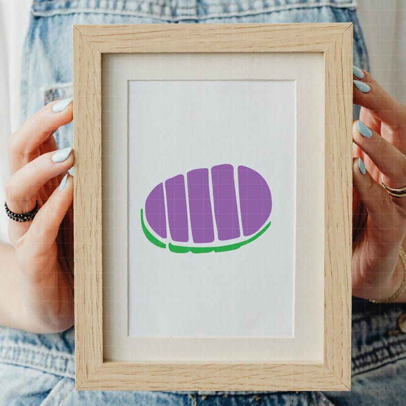 May include: A framed print featuring a purple and green graphic design. The design is an oval shape with vertical purple lines and a green outline. The frame is made of light-colored wood.