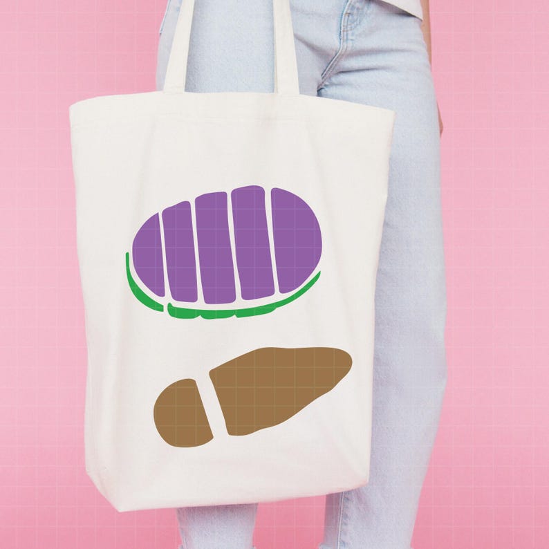 May include: A white tote bag featuring a purple and green design, along with a brown footprint graphic. The bag has two handles and is made of a sturdy fabric. The design is a cartoon-like illustration.