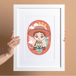May include: A framed cartoon illustration of a cowgirl character in a pink oval frame. The cowgirl wears a hat, a yellow shirt, and blue jeans. The background includes stars, clouds, and a rainbow.