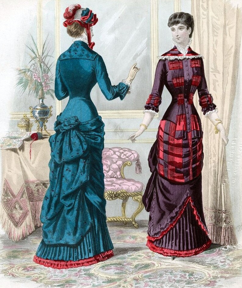 May include: Two women in fashionable dresses from the late 1800s. The woman on the left is wearing a teal dress with a red trim and a red and white hat. The woman on the right is wearing a burgundy dress with a red and white plaid pattern.