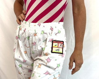 Pantalones holgados de fiesta estilo años 80 con estampado de palmeras neón de Hammer Time - Tri-Fit