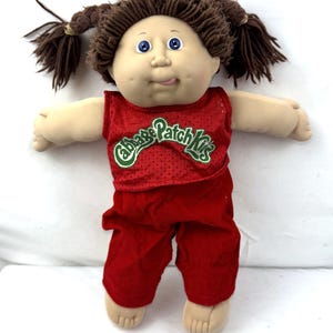Ensemble vintage des années 1980 Cabbage Patch Kids CPK comprenant un porte-bébé et une poupée KT
