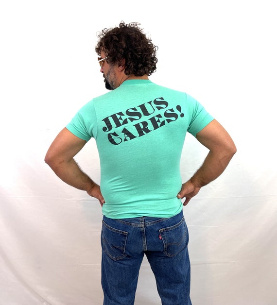 Vintage 1980s 80s Jesus Cares Christian Tee Shirt 