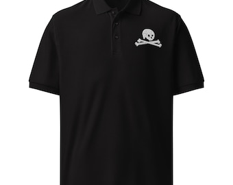 May include: Black polo shirt with a white skull and crossbones design on the left chest. The shirt has a collared neckline and short sleeves. The skull and crossbones are a classic pirate symbol.