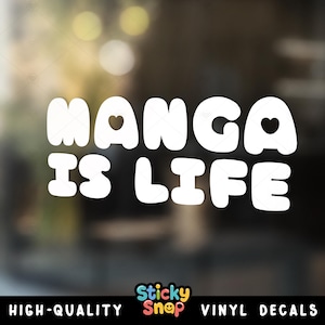 May include: White vinyl decal with the text "MANGA IS LIFE" in a bold, rounded font. The word "MANGA" has a heart shape in the letter "A". The bottom of the decal reads "HIGH-QUALITY VINYL DECALS".