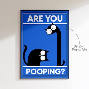 May include: A framed art print featuring a blue background with the text "ARE YOU POOPING?" in white. Two black cat illustrations are depicted, one in a sitting position and the other with an elongated neck. The art is titled "03 Cat Pooping Blue".
