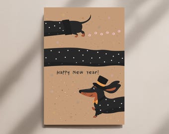 May include: A greeting card with a tan background featuring two dachshunds. One dachshund is wearing a top hat and a bow tie. The card has the text "Happy New year!" and a dotted pattern.