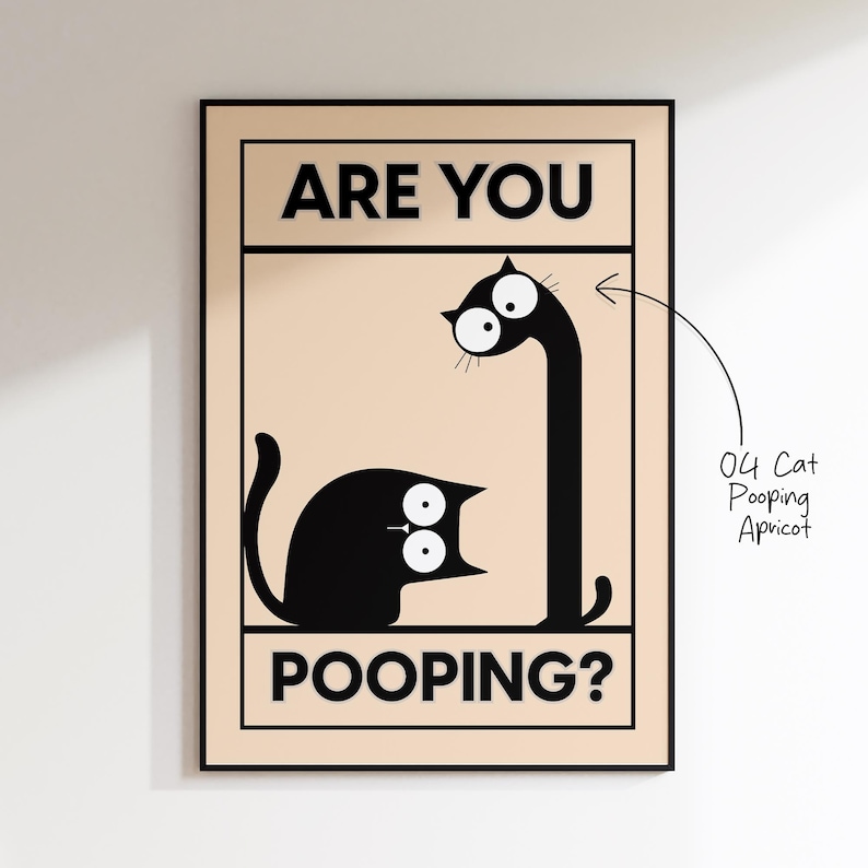 May include: A framed art print featuring a black cat with large eyes and the text "ARE YOU POOPING?". The cat's body is in a sitting position, and its head is turned upwards. The print has a beige background.