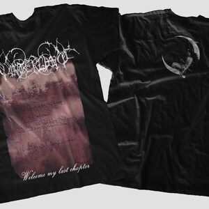 May include: Black t-shirt with a white graphic print of a band name and the text "Welcome my last chapter". The back of the shirt has a white crescent moon graphic.
