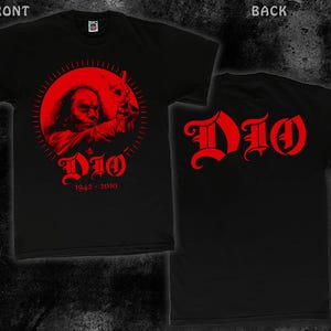 May include: Black t-shirt with a red image of Ronnie James Dio, the singer of the band Dio, with the text "Dio 1942-2010". The back of the shirt has the word "Dio" in red.