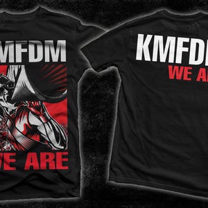 May include: Black t-shirt with a white graphic print of "KMFDM WE ARE" on the front and back. The front graphic features a stylized image of a person holding a microphone.