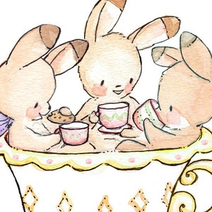 May include: Three brown bunnies sit inside a large teacup, drinking tea and eating cookies. The teacup is decorated with yellow and gold swirls and pink polka dots.