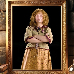 May include: A framed portrait of a woman in a gold frame, set against a stone wall. The woman wears a tan sweater with purple accents and a yellow floral skirt. A quill, inkwell, and open book with a tree illustration are on the table.