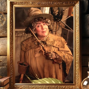 May include: A framed portrait of a woman wearing a brown hat and a brown robe, holding a wand. The portrait is set against a brick wall with candles and books.
