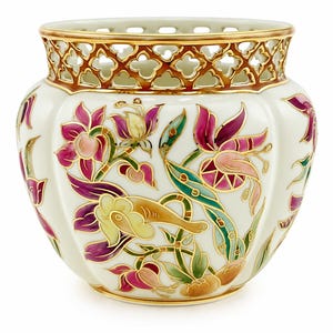 May include: A white porcelain bowl featuring a decorative openwork rim with gold trim. The exterior is adorned with a colorful floral pattern in shades of magenta, teal, and yellow, outlined in gold. The bowl has a rounded, bulbous shape.