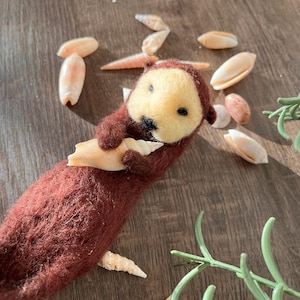 The Sea Otter playing with a Seashell Needle-Felted