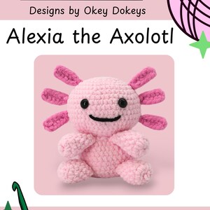 May include: A crocheted pink axolotl plushie named Alexia, with pink gills and a smiling face. The image includes the text "Okey Dokeys" and "Designs by Okey Dokeys".