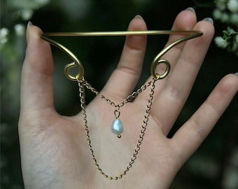 Brazalete de oro con perla