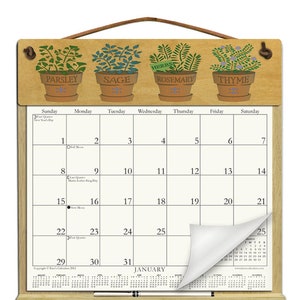 Wooden Calendar Holder filled with the rest of 2025 and 2026 calendars and includes an order form for 2027 - HERBS
