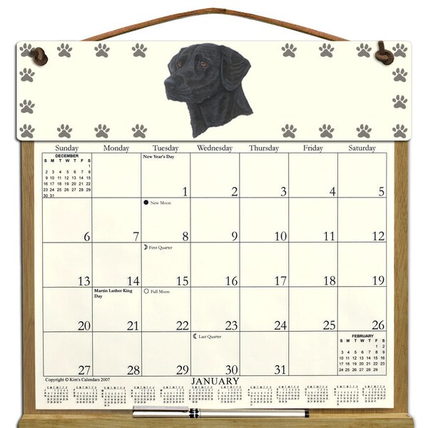 Black Labrador Retriever Calendar Holder filled with a 2025 calendar and includes an order form for 2026.