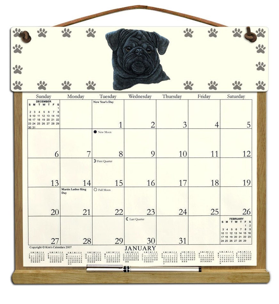Black Pug Calendar Holder Filled With a 2025 Calendar and Includes an