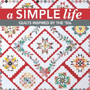 May include: A book cover featuring a quilt design with red, white, and blue colors. The title is "a SIMPLE life" and the subtitle is "QUILTS INSPIRED BY THE '50s". The book is a Kansas City Star Quilts Block of the Month.