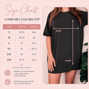 May include: A size chart for a Comfort Colors 1717 t-shirt, displaying a table with sizes S through 3XL and their corresponding width and length measurements in inches. The chart includes a visual guide on a black t-shirt showing width and length.