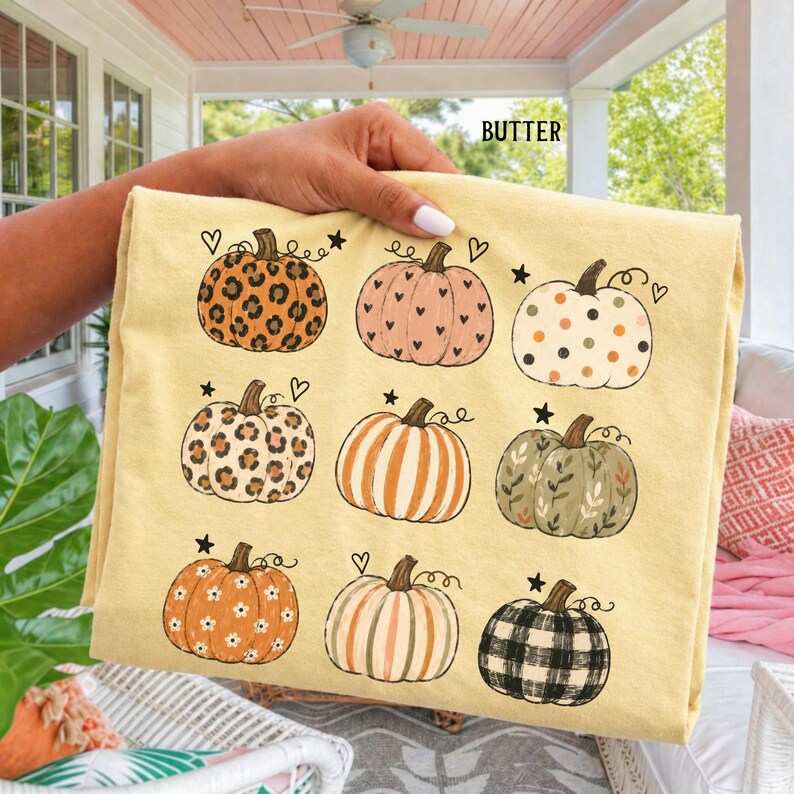 Boho fall pumpkin shirt featuring nine hand drawn pumpkins with leopard print, florals, hearts, polka dots, stripes and plaid patterns, perfect for a cute autumn outfit, pumpkin season, Thanksgiving and cottagecore fall style.