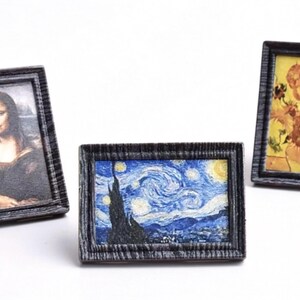 May include: Miniature framed art prints featuring famous paintings. Includes a print of the Mona Lisa, Van Gogh's Starry Night, and a floral still life. Each print is in a dark gray textured frame.