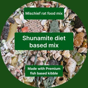 May include: A close-up of a mix of rat food with text that reads "Mischief rat food mix", "Shunamite diet based mix", and "Made with Premium fish based kibble". The food contains various grains, seeds, and kibble.