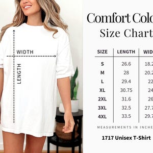 May include: A white Comfort Colors unisex t-shirt with a size chart. The chart shows measurements in inches for sizes S to 4XL. The shirt is being modeled by a person.
