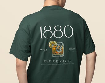 May include: Dark green t-shirt featuring the number "1880" in white, and a cocktail graphic with a lemon slice and ice cubes. The text "THE ORIGINAL" and "WKSY BOUR" are also visible.