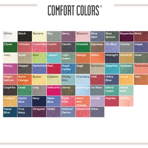 May include: A Comfort Colors brand color chart featuring a grid of numerous fabric swatches in various shades including white, black, green, blue, red, yellow, and pink. Each square is labeled with its corresponding color name in black text.