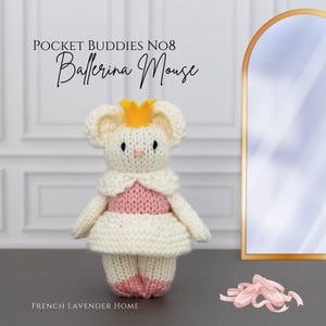 May include: A knitted ballerina mouse toy, white with a pink bodice and ballet slipper feet. It wears a yellow crown and a white collar. The text "Pocket Buddies No8 Ballerina Mouse" is above the mouse. The words "French Lavender Home" are below.