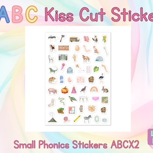 May include: Sheet of kiss-cut stickers with various watercolor illustrations, including animals, objects, and food items. The stickers are labeled "ABC Kiss Cut Stickers" and "Small Phonics Stickers ABCX2". The background is a pastel rainbow.
