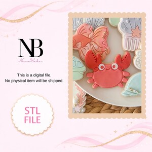 May include: A digital file for an STL file featuring a collection of ocean-themed cookies, including a red crab, a pink fish, and various seashells in pastel colors. The text NB Nuva Bake, This is a digital file. No physical item will be shipped. STL FILE is visible.