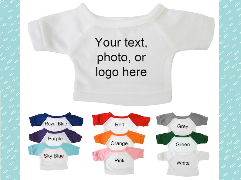 May include: A white t-shirt with the text "Your text, photo, or logo here" printed on it. The t-shirt is shown on a plush toy with different colored sleeves: royal blue, red, grey, purple, orange, green, sky blue, pink, and white.