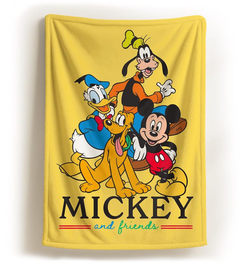 May include: Yellow blanket featuring Mickey Mouse, Donald Duck, Goofy, and Pluto. The blanket has the words "MICKEY" and "and friends" in black and green, with red stripes. The characters are in their classic cartoon styles.