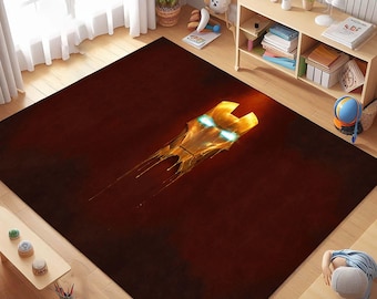 May include: A red area rug with a gold metallic Iron Man mask design. The mask has glowing blue eyes and is dripping with gold liquid.