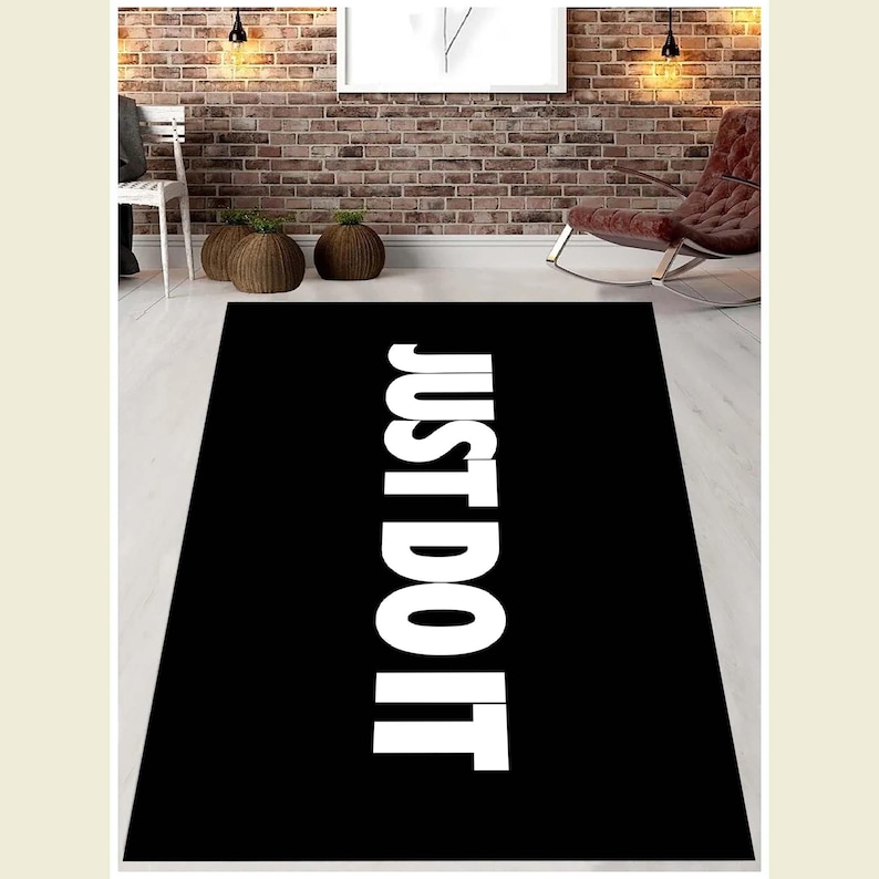 May include: Black and white rug with the text "JUST DO IT" printed in white on a black background.