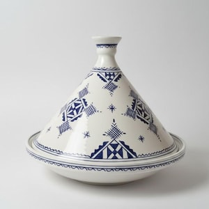 Elevate your cooking with a handmade Moroccan clay tagine, ideal for slow cooking and serving.
Handcrafted Moroccan tagine made of natural clay, perfect for authentic meals and decorative kitchens.