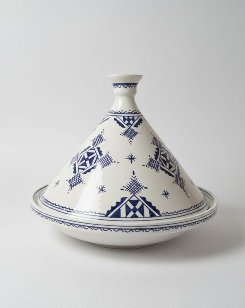 Elevate your cooking with a handmade Moroccan clay tagine, ideal for slow cooking and serving.
Handcrafted Moroccan tagine made of natural clay, perfect for authentic meals and decorative kitchens.