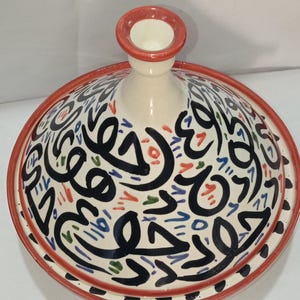 Add Moroccan charm to your home with our hand-painted ceramic tagine, perfect as a centerpiece or serving dish. Transform your table with the vibrant artistry of our decorative ceramic tagines, handmade to inspire conversation.