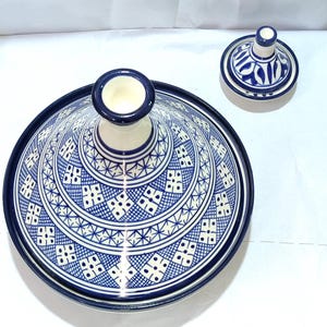 Crafted from high-quality ceramic, this Moroccan tagine combines functionality and elegance. The domed lid traps steam to infuse ingredients with robust flavors. Discover the art of Moroccan cooking with this versatile ceramic tagine.
